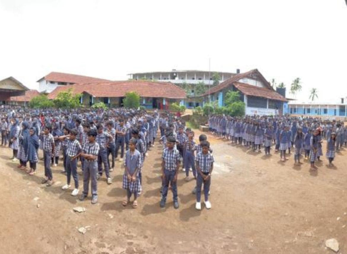 Students in uniform lined up on the school ground, Wandoor